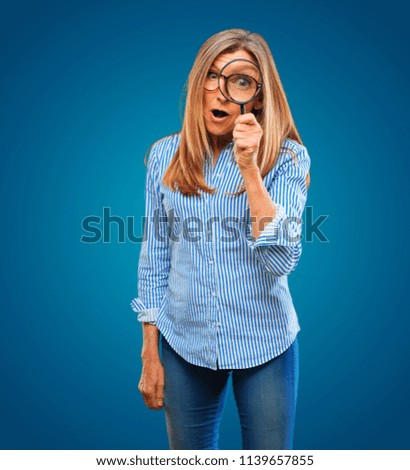 Similar – Image, Stock Photo Senior woman with magnifying glass