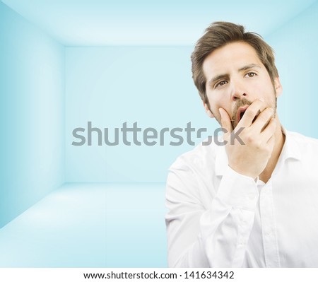 young man boring in an empty room