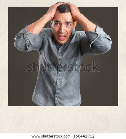 young man scared gesture on photo frame