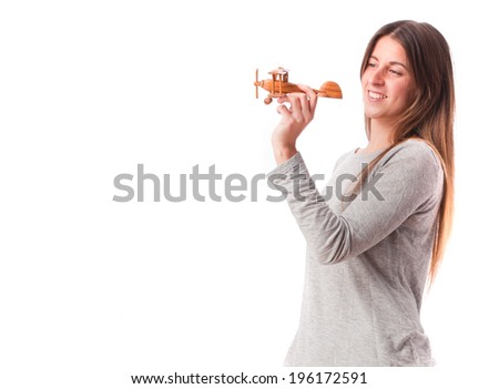 Happy girl holding a wood plane