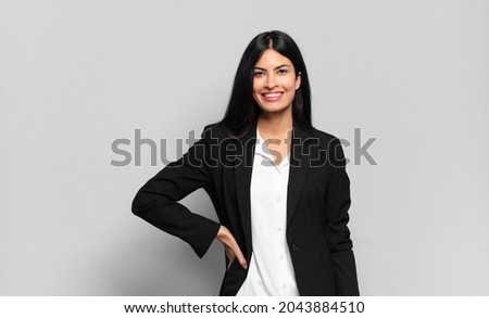 Image, Stock Photo Young spanish woman with curly hair showing victory sign with a cute smiling face while working on his laptop. Close up portrait. Freelancer happy to work by her own