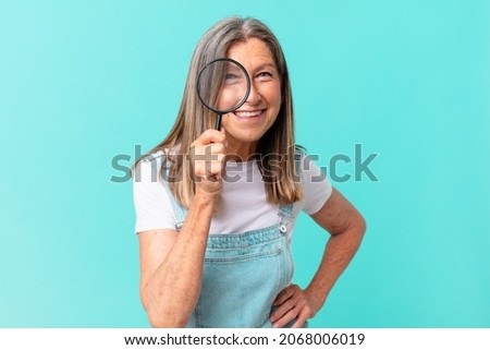 Similar – Image, Stock Photo Senior woman with magnifying glass