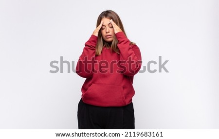 young blonde woman looking stressed and frustrated, working under pressure with a headache and troubled with problems Сток-фото © 