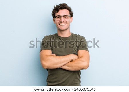 Similar – Image, Stock Photo Happy young guy smiling with closed eyes against red background