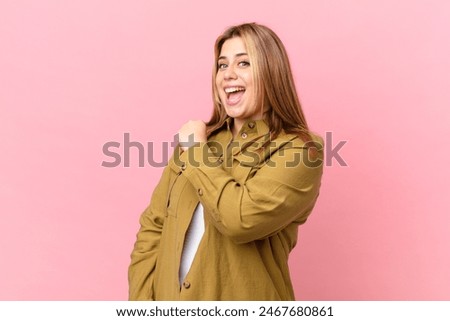 Similar – Image, Stock Photo proud blonde fashion beauty model woman, with red mouth and black fabric, cloth with hair electrostatic charged, sticking to cape, against black background