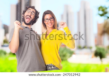 young cool couple proud sign