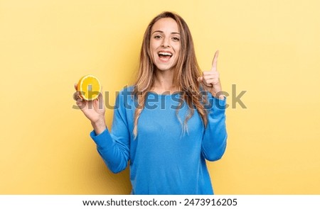 Similar – Image, Stock Photo Woman showing half orange over bowl