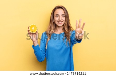 Similar – Image, Stock Photo Woman showing half orange over bowl