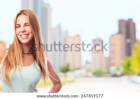 young cool woman winking an eye