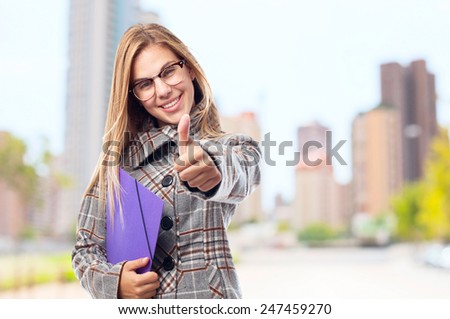 young cool woman all right sign and a folder