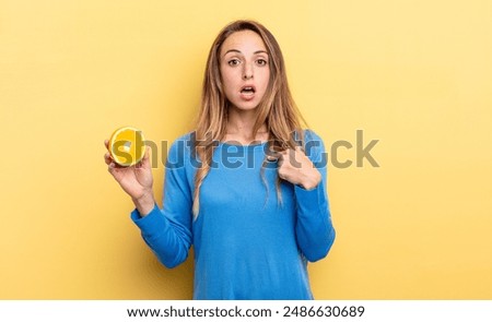 Similar – Image, Stock Photo Woman showing half orange over bowl