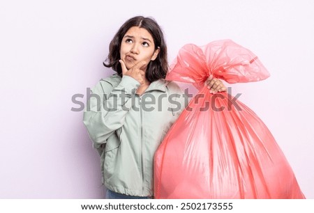Similar – Image, Stock Photo Pensive Pretty Young Woman in a casual pose sits on a chair barefoot