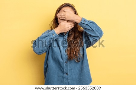 Similar – Image, Stock Photo Confident ethnic lady covering eye with hand in red studio