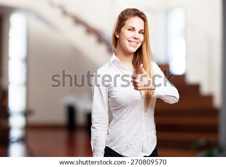 blond woman okay sign. rich house background