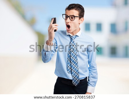 angry businessman on phone. company build background