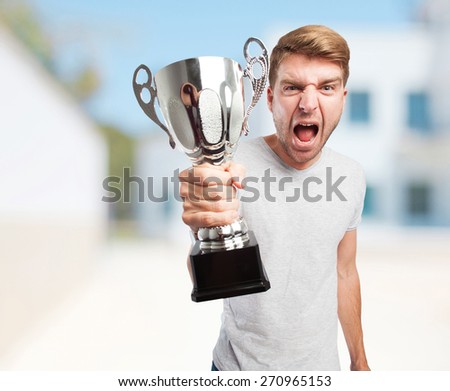 blond winner man with a cup