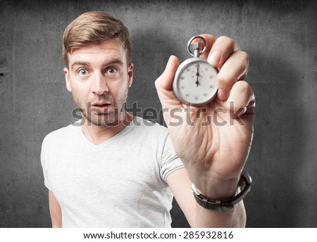 blond man with a stopwatch