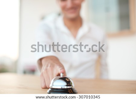 happy young man with ring bell