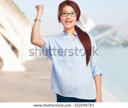 happy chinese woman celebrating success