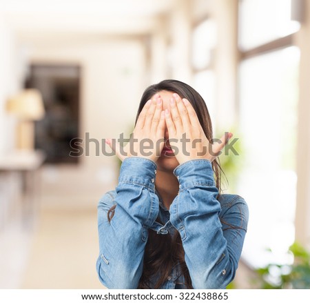 happy young woman covering eyes