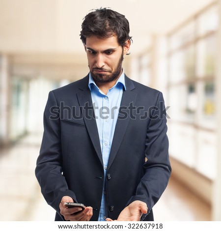 confused businessman with mobile