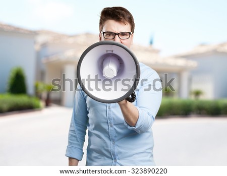 angry young man with megaphone