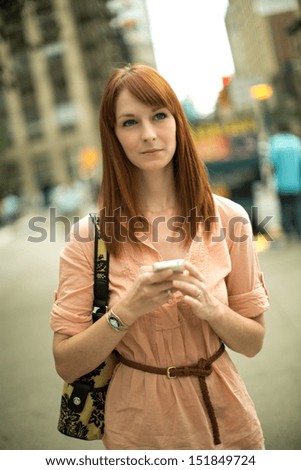 Caucasian woman female using a cellphone iphone