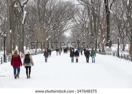 NEW YORK - CIRCA JANUARY 27, 2015: People walking in Central Park in winter snow