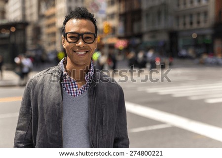 Young Black African Asian mixed man in city smile happy face portrait