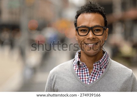 Young black African Asian man in city smile happy face portrait
