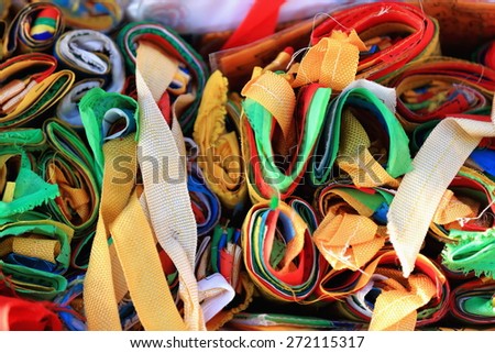 Rows of reels of manycolored buddhist prayer flags-shop in a street in the Barkhor area. Lhasa city and prefecture-Tibet A.R.-China.