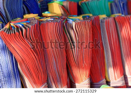 Rows of reels of manycolored buddhist prayer flags-shop in a street in the Barkhor area. Lhasa city and prefecture-Tibet A.R.-China.