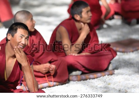 SERA, TIBET, CHINA - OCTOBER 19: Monks debate on doctrine-learning process-better comprehension of philosophy on October 19, 2012. Sera-Wild Roses monast.of Gelugpa-Yellow Hat order. Lhasa-Tibet-China