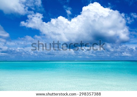 background landscape with turquoise sea, blue sky in the Caribbean Maldivian Hawaiian Bahamas