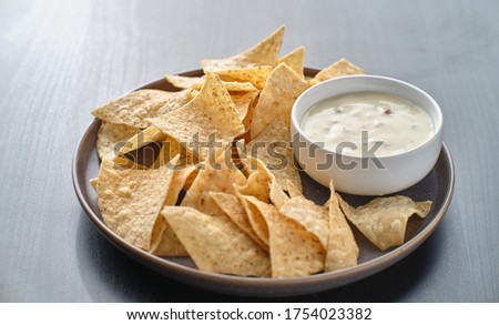 mexican hot queso blanco cheese dip with corn tortilla chips on plate Stockfoto © 