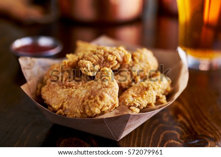 basket of tasty fried chicken tenders Stock foto © 