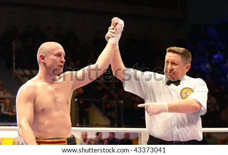 YEKATERINBURG - DECEMBER 19: Boxer Lukas Konecny (Czech, the champion of the Europe) and referee Panin on the International tournament on professional boxing December 19, 2009 in Yekaterinburg, Russia