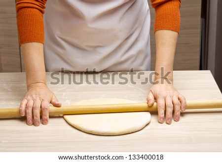 woman hands knead dough