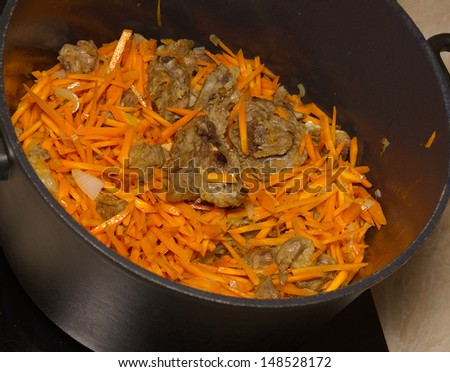 Pilaf, meat carrots and spices.