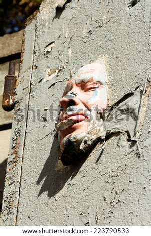 PARIS,FRANCE - September 25, 2014: face mask at a wall. Street art from Gregos who creates replicas of his face.