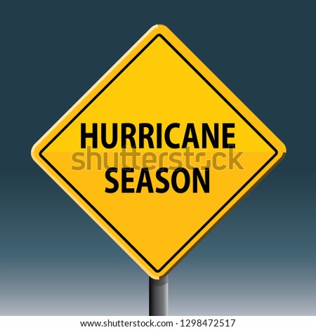 hurricane season road sign, stormy sky 