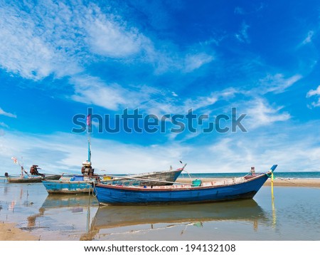 Fishing boat at clean beach in Thailand