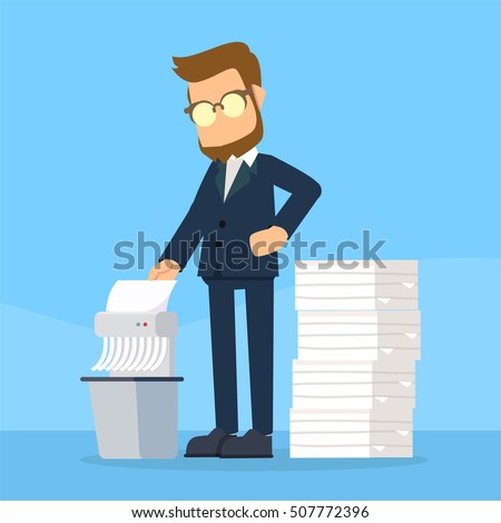 businessman shredding old files