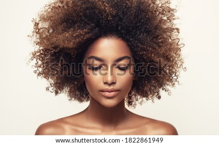 Beauty portrait of african american black  woman with clean healthy skin .Life style and cosmetic. Beautiful afro girl.Curly  hair Foto stock © 