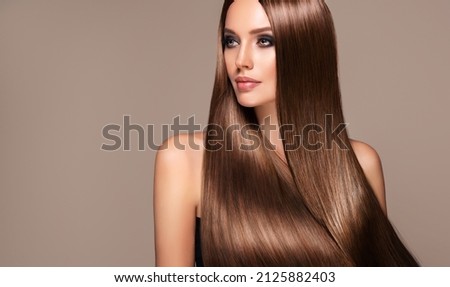 Beautiful model girl with shiny brown and straight long  hair . Keratin  straightening . Treatment, care and spa procedures. Smooth hairstyle
 Stock foto © 