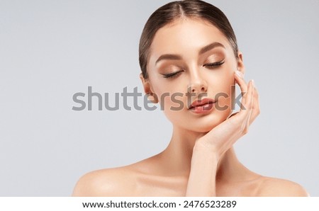 Similar – Image, Stock Photo Young beautiful woman with short curly hair meditating in light fitness studio. Hands in namaste. Pray, gratitude, yoga, love God concept.