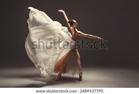 Similar – Image, Stock Photo Graceful woman dancing in dark park