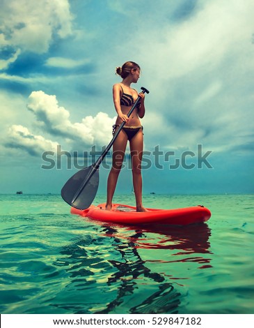 Similar – Image, Stock Photo Woman with boat standing in river