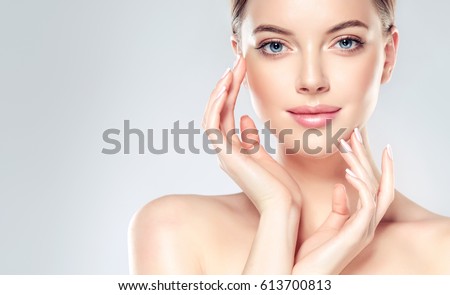Similar – Image, Stock Photo Beautiful female face with perfect skin and nude makeup. Close-up portrait against the background of nature