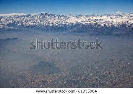 aerial view of Andes and Santiago with smog, Chile, focus on the mountains
